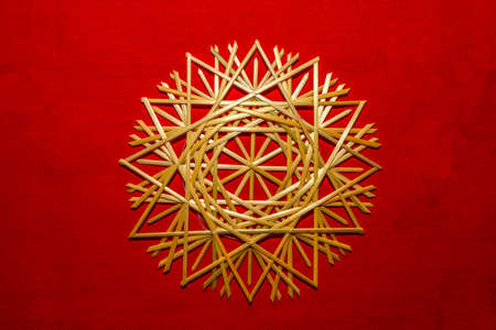 Very beautiful snowflakes woven from rye straw. Folk craft tradition.の写真素材
