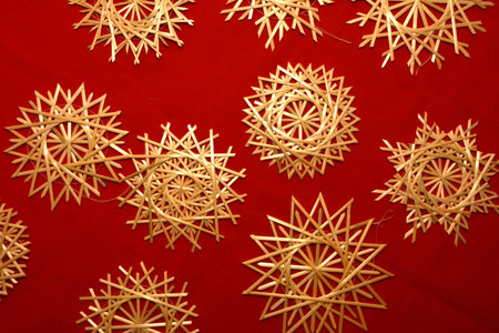 Very beautiful snowflakes woven from rye straw. Folk craft tradition.の写真素材