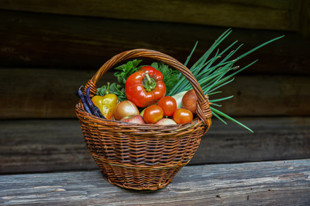 Fresh Vegetable And Food in Basket .Fresh vegetables in basket on wooden background .Composition with vegetables and fruits in wicker basketの写真素材