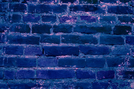 Brick wall background .A Full Frame Background Of A Rough And Textured Brick Wall With Visible Wear And Tare And Copy Space .old blue brick wall texture backgroundの写真素材