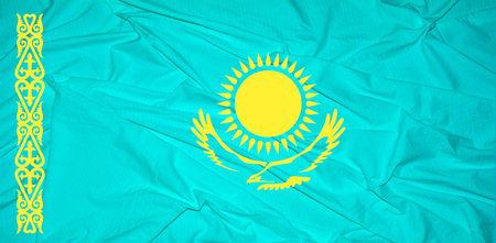 Waving flag of the Kazakhstan. Flag in the Wind. national mark. Waving Kazakhstan Flag. Kazakhstan Flag Flowing.Flag of Kazakhstan Brick wall texture .の写真素材
