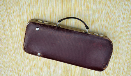 small antique clarinet case on white.old case for musical instrument .