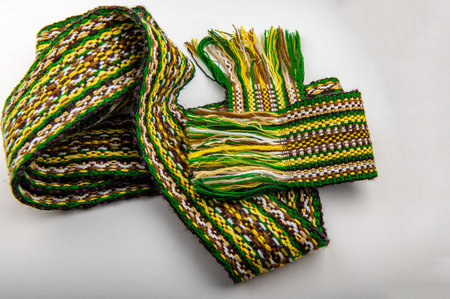 A traditional Ukrainian belt woven from woolen threads.A bright element of folk costume. The belt is...