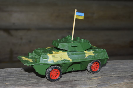 Mini models of armored personnel carriers placed on stand. Kyiv Ukraine.a plastic children's toy armored personnel carrier as a symbol of war in ukraine.の写真素材