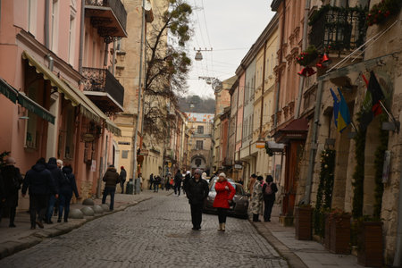 Lviv, Ukraine. January 7, 2023.Street decoration for the Christmas and New Year holidays in rays of sun in Lviv.Lviv during Christmas.Lots of people on the streets.のeditorial素材