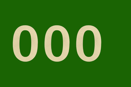 Red Number 000 on the white wall. Spray paint.White number 000 on a brown and light brown background.の写真素材