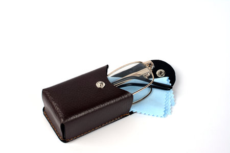 folding glasses anti radiation mini case fashion.Folding reading glasses with hard case on white background.の写真素材