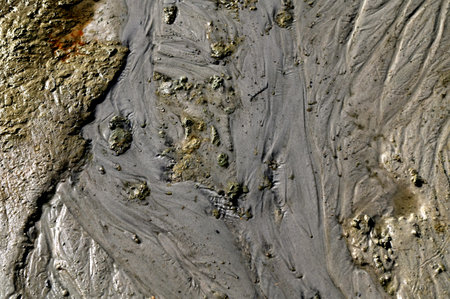 Tiny fractal landscape.Erosion pattarn on the sand.Wavy patterns in beach sand formed by wind,...