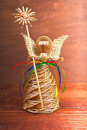 Home decoration with a straw handmade angel.Decoration, home decoration. Angel made of straw.の写真素材