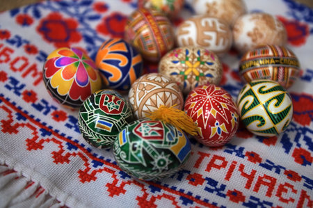 Lviv. Ukraine. March 5, 2025.Pysanka Eggs from Ukraine.Flat lay of assorted hand-painted Ukrainian Pysanka eggs, featuring vibrant colors and traditional patterns, placed next to spring blossoms.の写真素材