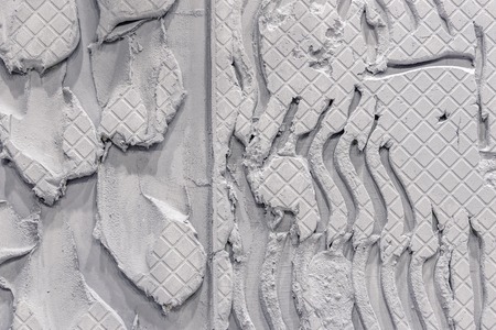 Cement wall with an unusual pattern. Texture background, gray colorの写真素材