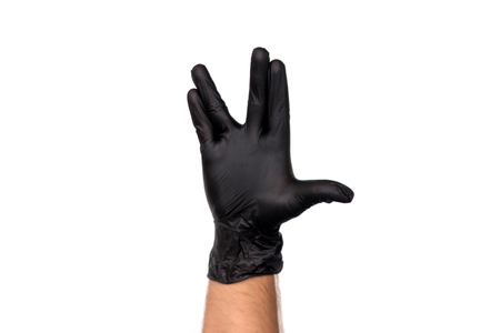 Hand in a black rubber glove. Isolate on white background. Concept Gesture SpoÑk from the series The Big Bang Theoryの写真素材