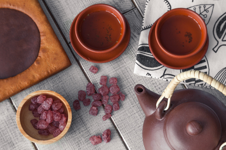 Tea ceremony, tea drinking with pottery. The concept of a cozy evening in a family restaurantの写真素材