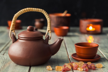 Tea ceremony, tea drinking with pottery. The concept of a cozy evening in a family restaurantの写真素材