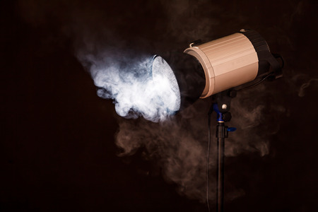 Close-up of professional studio light. Concept photoshoot in the fogの写真素材