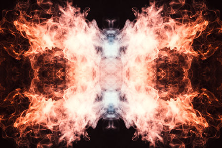 Abstract thick colored smoke orange and pink colour on a black background with a monster face. The...