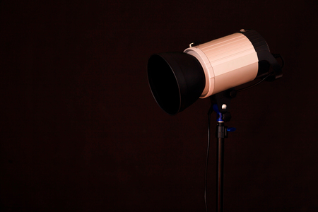 Close-up of professional studio light on the black background. Concept of photoshootの写真素材