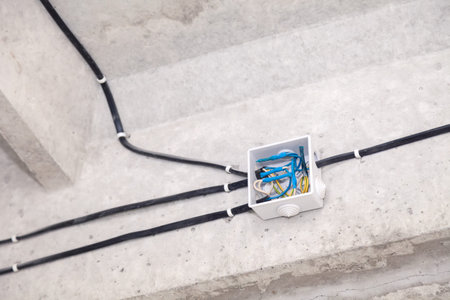 Cable laying ceiling. Electrical wires on wall. Wiring replacement. Connecting light in flat or...