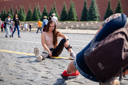 Russia Moscow 2019-06-17 Photographer takes pictures of a beautiful young girl with long hair...