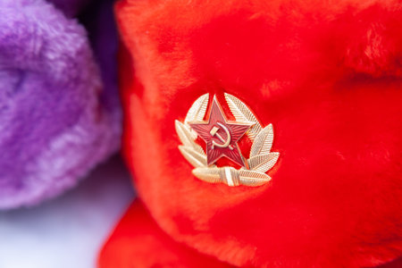 Earflaps fur caps with red stars in souvenir shop in Moscow street. Winter hats, soviet and russian...