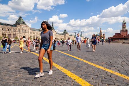 Russia Moscow 2019-06-17 Pictures of beautiful latin young woman going on paving stones on Red Square. Hobby and travel.のeditorial素材