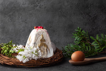 White easter kulich cake, egg on dark background
