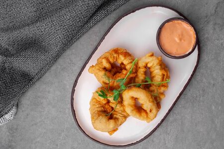 Portion of hot appetizer for beer - calamari or squid deep fry ringsの写真素材