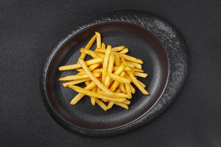 Portion of side dish in gray plate - crispy fat french fries