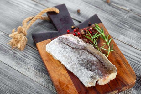 Fresh raw pike perch fish fillet on cutting board