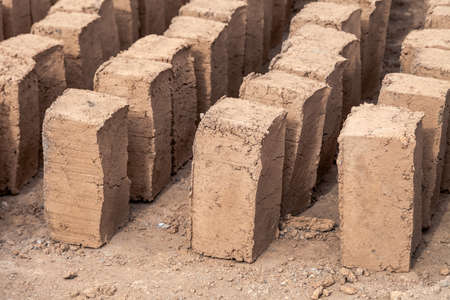 Production of clay brick in stacks, bricks are arranged on one by oneの写真素材