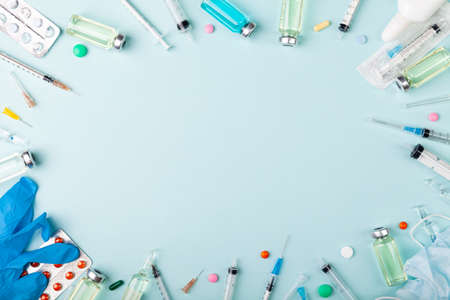 Glass vaccine ampoules, bottles, gloves, syringes, needles, pillsの写真素材