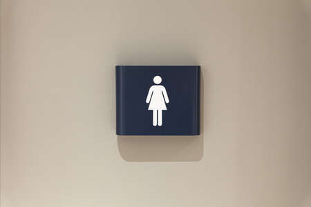 Toilet, wc icon, square white and dark blue sign on restroom doorの写真素材