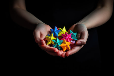Young women hands holding origami stars .generative ai.の素材