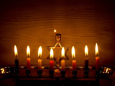 Hanukkah is a Jewish holiday. Burning Chanukah candlestick with candles. Chanukiah Menorah.の写真素材