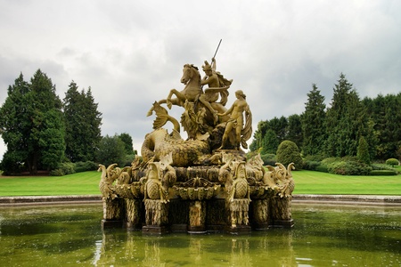 Witley Court fountain with statue. Green grass at background.のeditorial素材