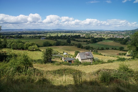 Rural Cotswolds landscape. Meadows, sunny weather. Houseの写真素材