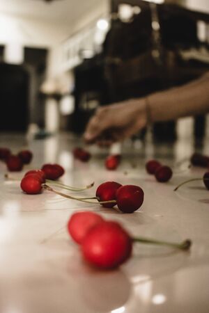DELICIOUS RED CHERRY ON THE FLOOR, BLOW MY MIND AND WANT TO EAT AS SOON AS POSSIBLEの写真素材