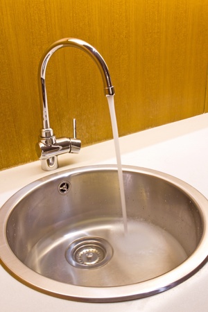 modern kitchen sink with stainless steel basinの写真素材