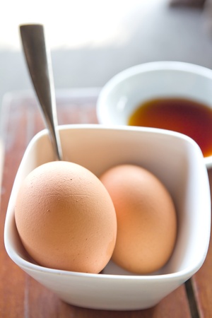 Boiled eggs and fish sauce in cupの写真素材