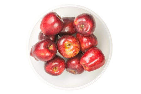 many red fresh apples  in bowlの写真素材