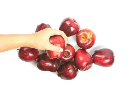 hand holding red fresh apple on whiteの写真素材