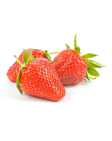three fresh red strawberries on white backgroundの写真素材