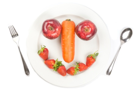 white dish smile with fruit and vegetableの写真素材