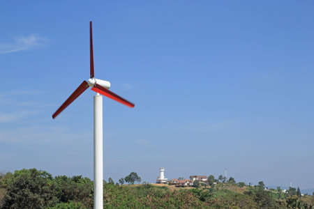 wind wheel in front of a blue, at mountain