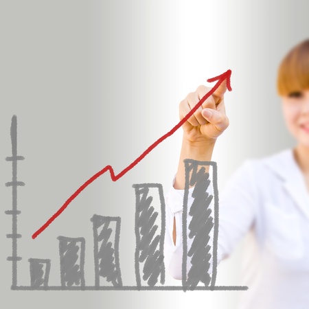businesswoman hand drawing a chartの写真素材