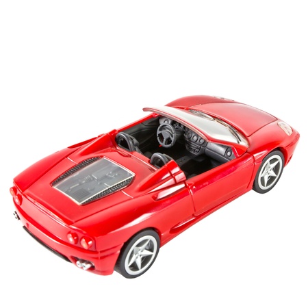red sports car miniature on white backgroundの写真素材