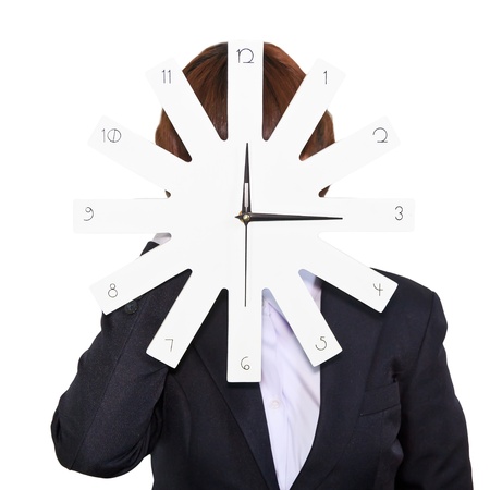 Business woman holding clock on white backgroundの写真素材