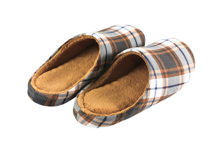 Vintage brown slippers isolated on white backgroundの写真素材
