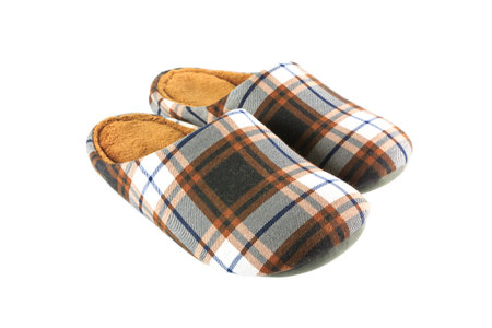 Vintage brown slippers isolated on white background