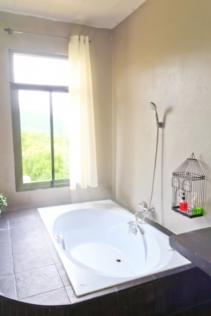bathroom in luxury home with nature outside windowのeditorial素材